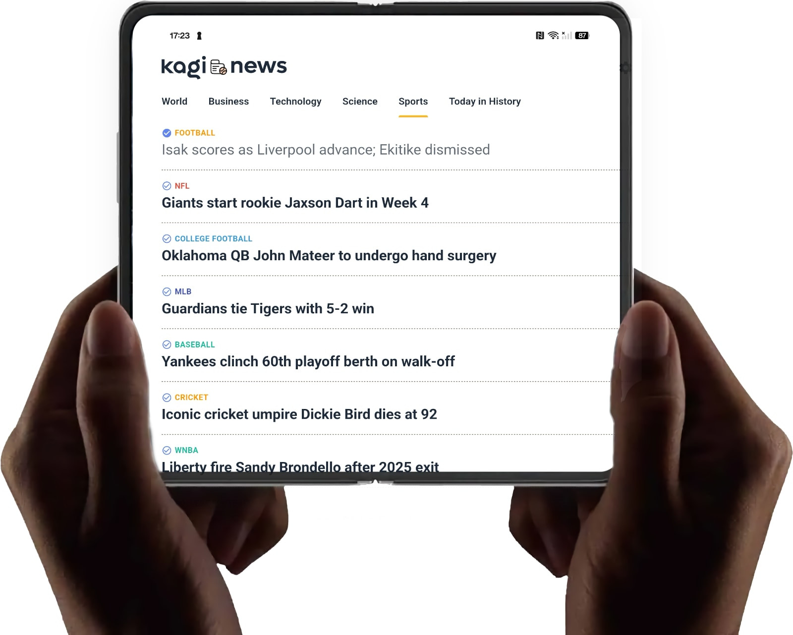 Two hands holding an open Android foldable phone displaying articles.